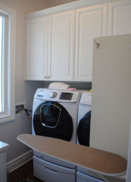 custom white laundry cabinets